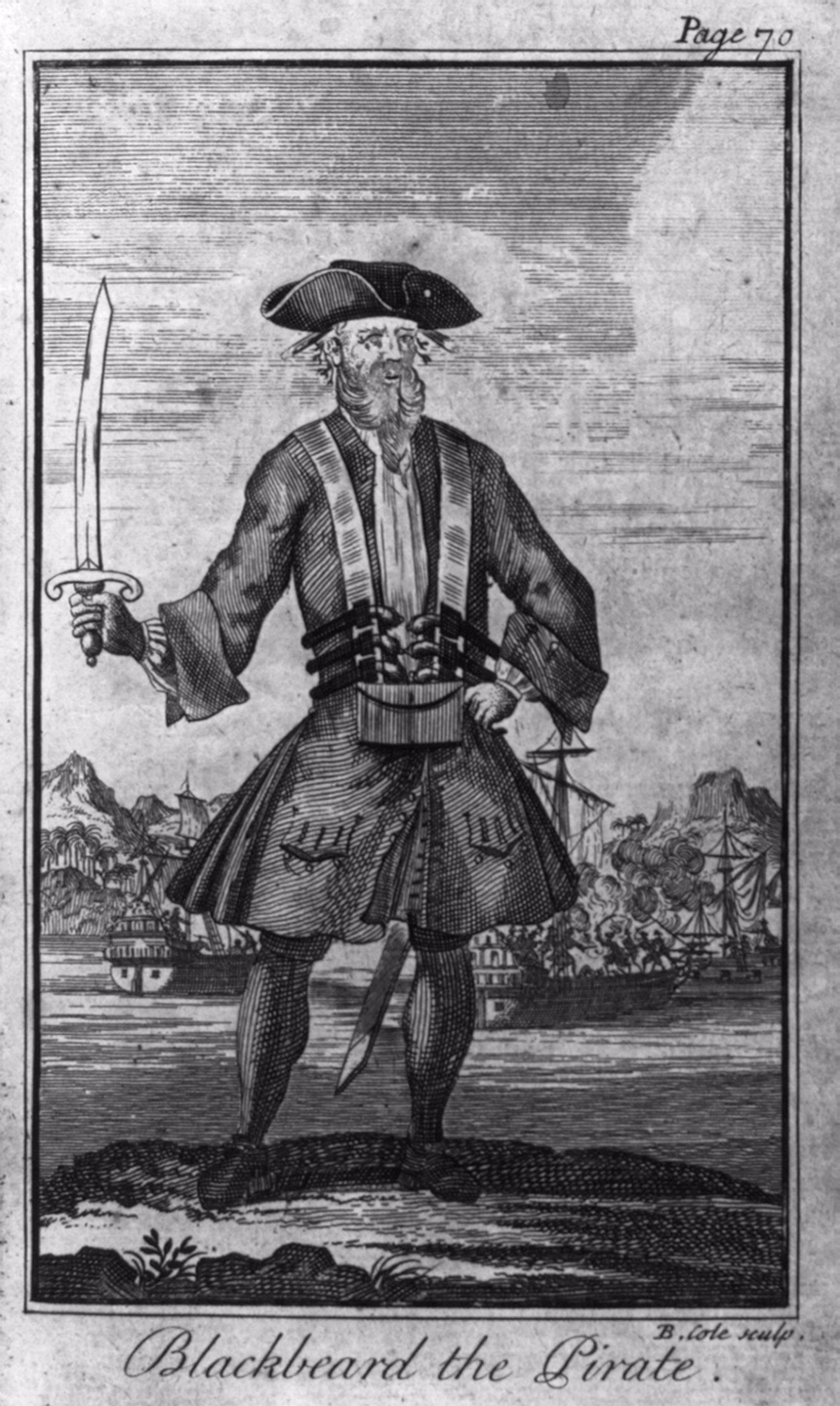 An 18th-century engraving of Blackbeard standing on a shore in a tricorn hat and long coat, holding a cutlass, with pistols across his chest and smoke trailing from under his hat, ships firing in the background